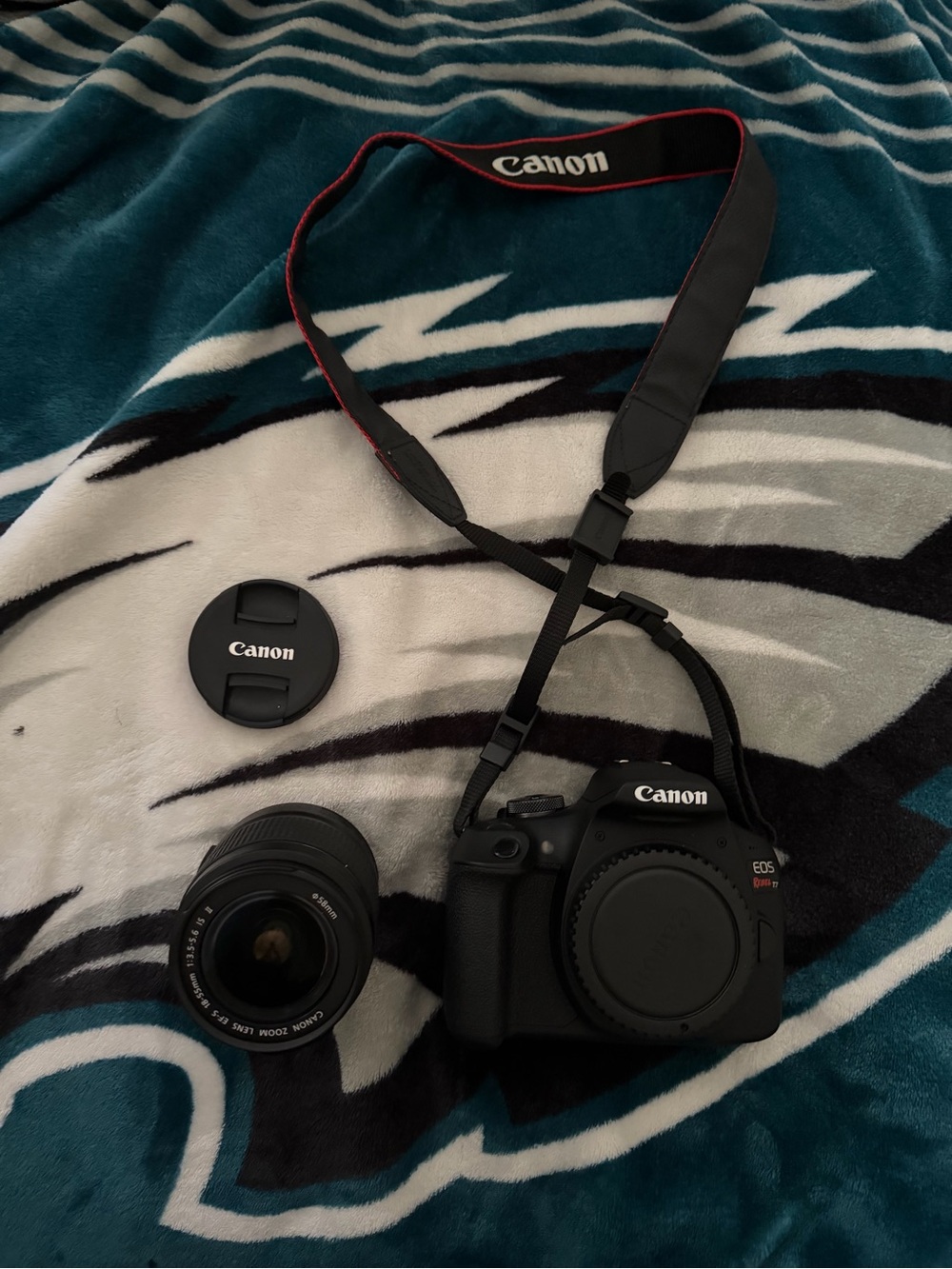 Canon EOS Rebel T6 DSLR Camera Body with Black Lens and Strap